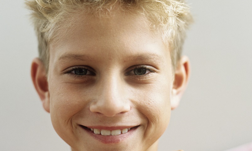 Boy (12-13) smiling,portrait,close-up